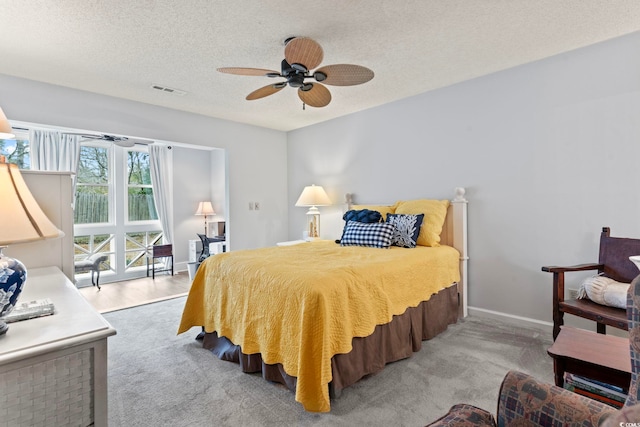 4396 Baldwin Ave Unit 94, Little River, SC 29566 - carpeted bedroom with a textured ceiling and a ceiling fan