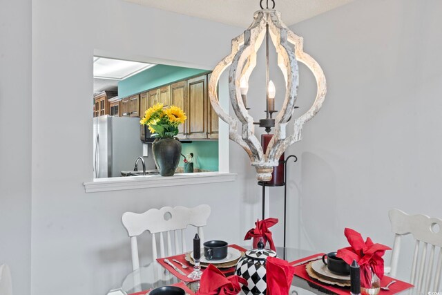 4396 Baldwin Ave Unit 94, Little River, SC 29566 - dining area view of freestanding refrigerator, a chandelier, and a sink