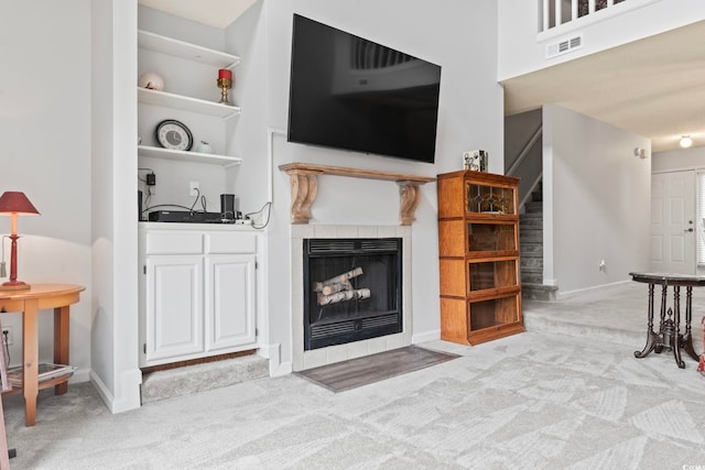 4396 Baldwin Ave Unit 94, Little River, SC 29566 - living room featuring carpet, stairs, and a fireplace