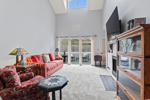 4396 Baldwin Ave Unit 94, Little River, SC 29566 - carpeted living area featuring high vaulted ceiling and a fireplace with flush hearth