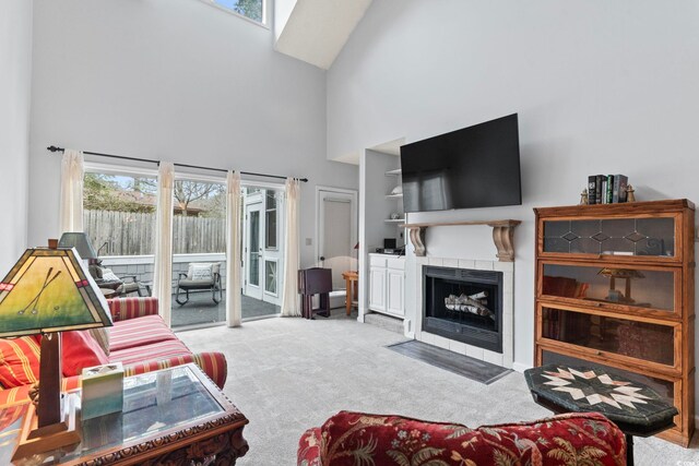 4396 Baldwin Ave Unit 94, Little River, SC 29566 - living area featuring high vaulted ceiling, carpet flooring, healthy amount of natural light, a fireplace, and a skylight
