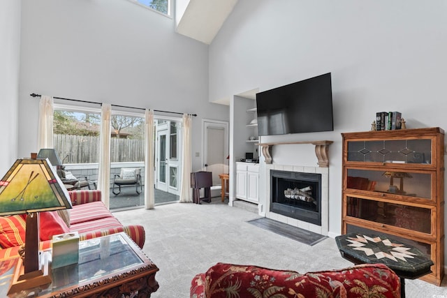 4396 Baldwin Ave Unit 94, Little River, SC 29566 - living room featuring high vaulted ceiling, carpet flooring, plenty of natural light, a tile fireplace, and a skylight