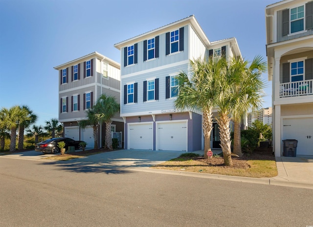 coastal home with a garage and concrete driveway