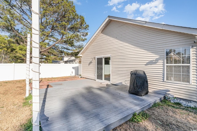 rear view of house featuring a deck