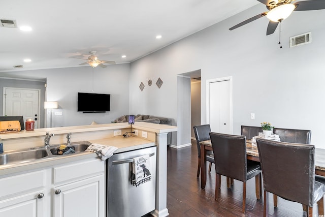 kitchen featuring sink, stainless steel dishwasher, dark hardwood / wood-style floors, ceiling fan, and white cabinets