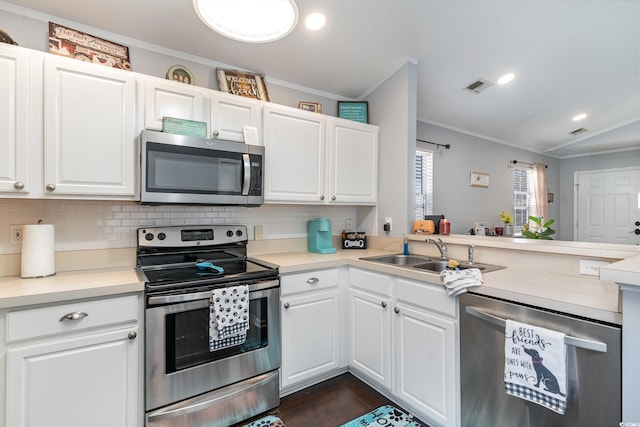 kitchen featuring sink, white cabinets, and appliances with stainless steel finishes