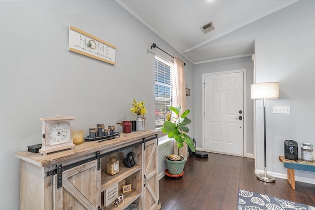 entrance foyer with crown molding, lofted ceiling, and dark hardwood / wood-style flooring