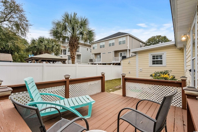 deck featuring a residential view and fence