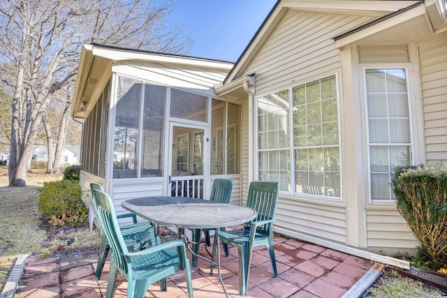 view of patio featuring a sunroom