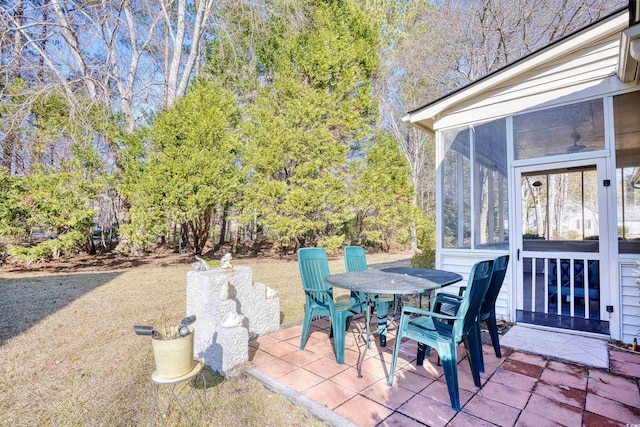 view of patio with a sunroom