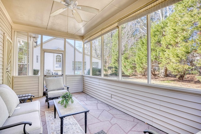 sunroom with ceiling fan and plenty of natural light