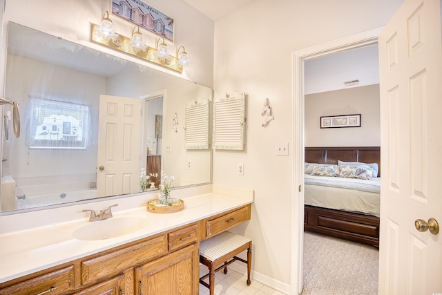 bathroom with vanity and a bath