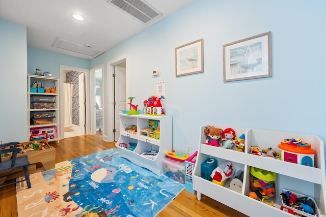 game room featuring hardwood / wood-style floors