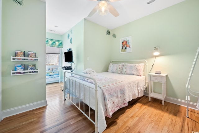 bedroom featuring ceiling fan and hardwood / wood-style floors