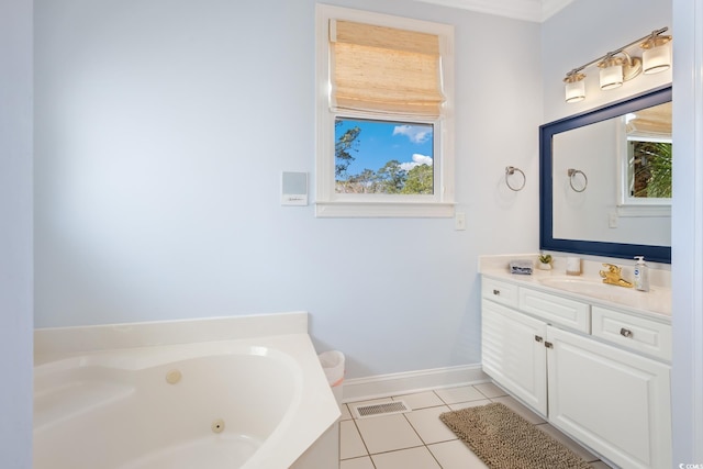 bathroom featuring tile patterned floors, vanity, and a tub