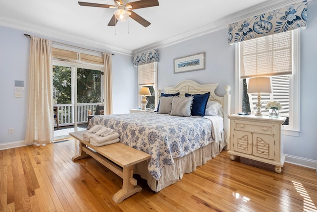 bedroom with multiple windows, access to outside, and ornamental molding