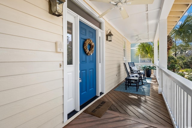 doorway to property with ceiling fan and covered porch