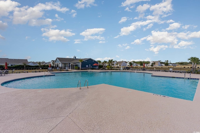 view of swimming pool featuring a patio