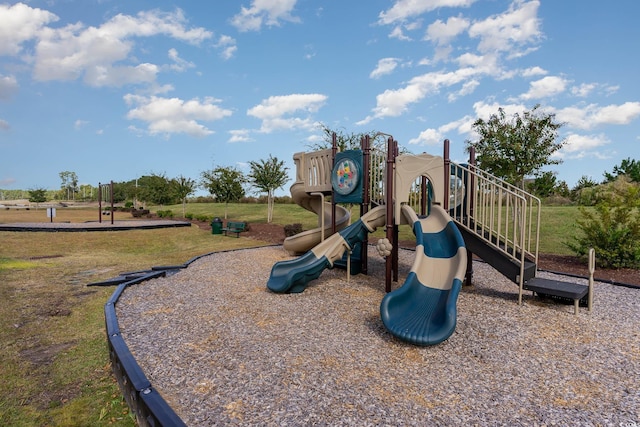 view of jungle gym featuring a lawn