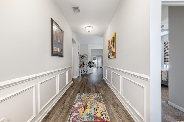 hallway with dark wood-type flooring