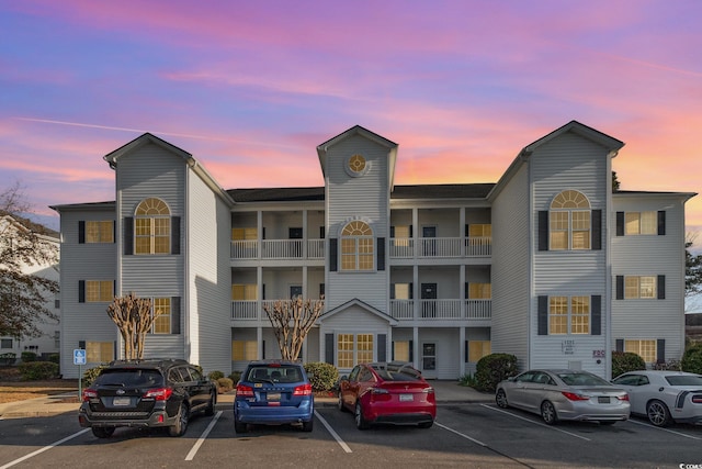 view of property with uncovered parking