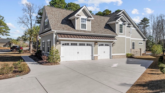 view of side of property with a garage