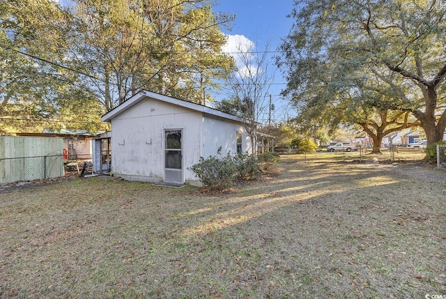 exterior space with a yard and fence