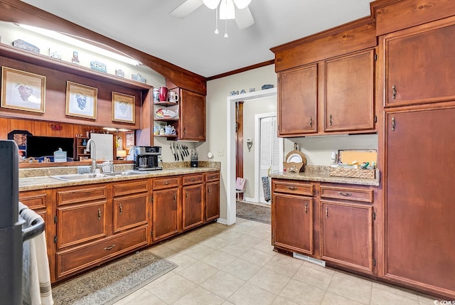 kitchen with brown cabinetry, a ceiling fan, ornamental molding, open shelves, and a sink