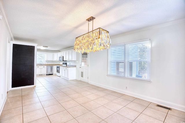 116 Great Lakes Rd, Pawleys Island, SC 29585 - kitchen featuring sink, stainless steel dishwasher, pendant lighting, white range with electric stovetop, and white cabinets