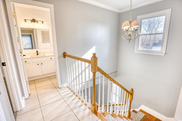 116 Great Lakes Rd, Pawleys Island, SC 29585 - corridor with light tile patterned floors, ornamental molding, sink, and a chandelier