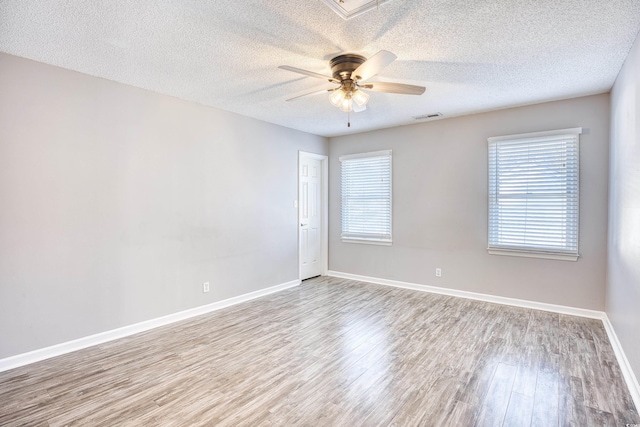 116 Great Lakes Rd, Pawleys Island, SC 29585 - unfurnished room with ceiling fan, a textured ceiling, and light hardwood / wood-style floors