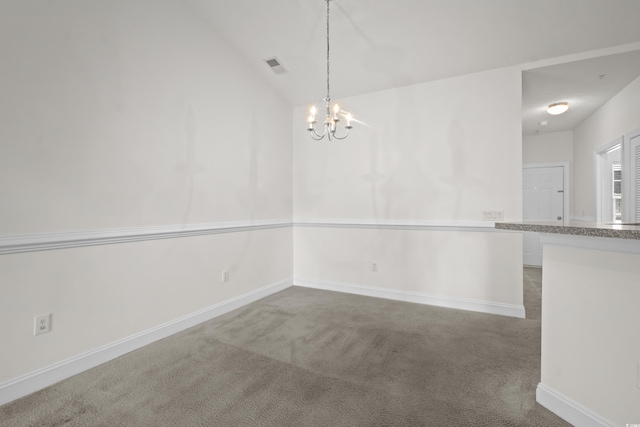 unfurnished dining area with a notable chandelier, vaulted ceiling, and carpet flooring