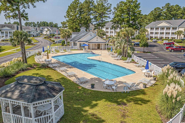 view of pool featuring a yard and a patio area