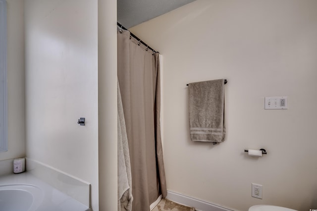 bathroom with sink and toilet