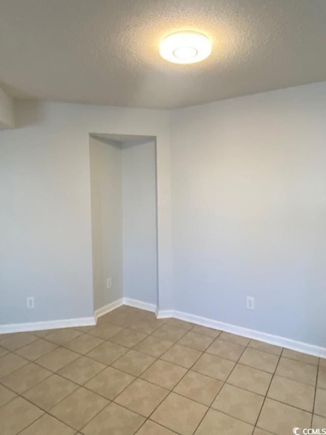 empty room with a textured ceiling