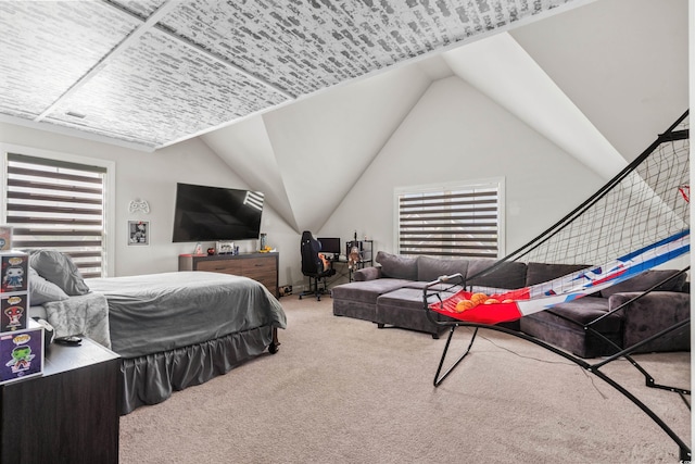 carpeted bedroom with vaulted ceiling