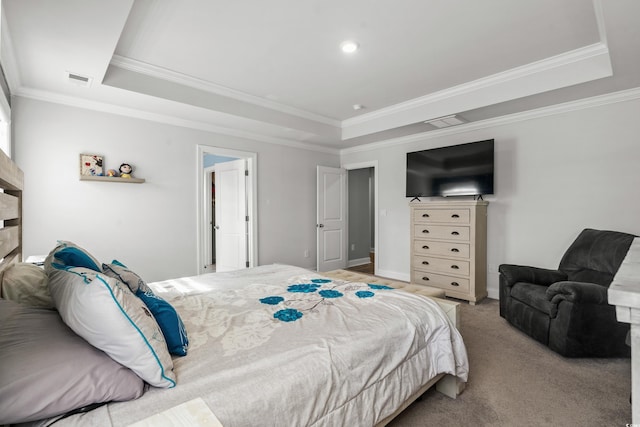 bedroom with ornamental molding, light carpet, and a tray ceiling