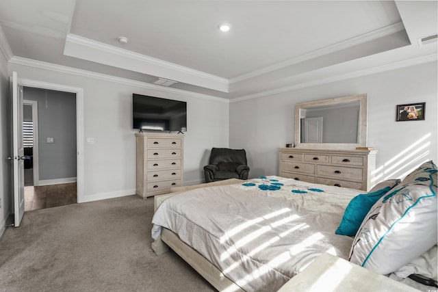 carpeted bedroom with a raised ceiling and ornamental molding