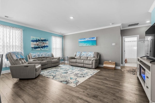 living room with ornamental molding and dark hardwood / wood-style flooring