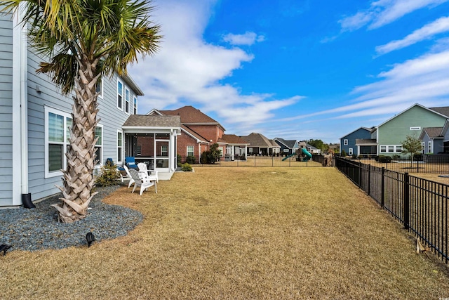 view of yard with a sunroom