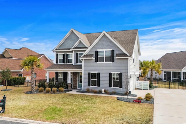 craftsman house featuring a porch and a front lawn