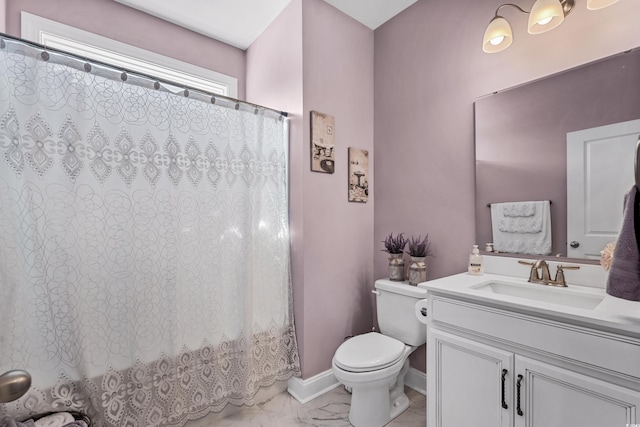 bathroom with vanity, toilet, and curtained shower