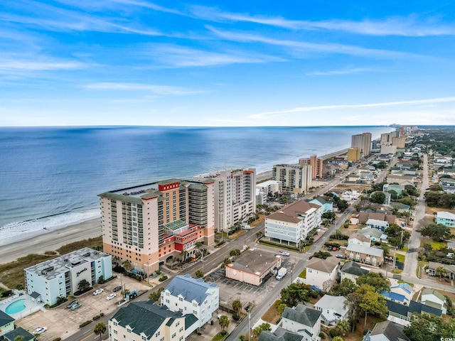 aerial view with a water view and a beach view