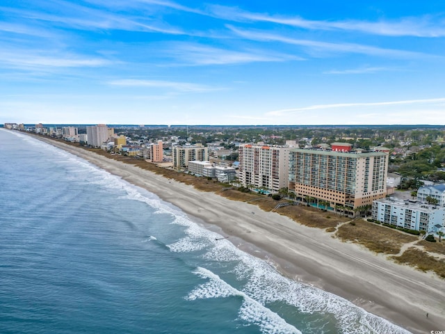 birds eye view of property with a view of the beach and a water view