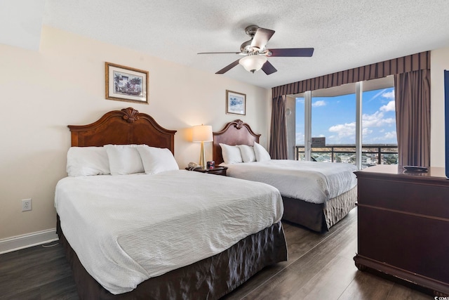 bedroom with dark wood-type flooring, ceiling fan, a textured ceiling, and access to outside