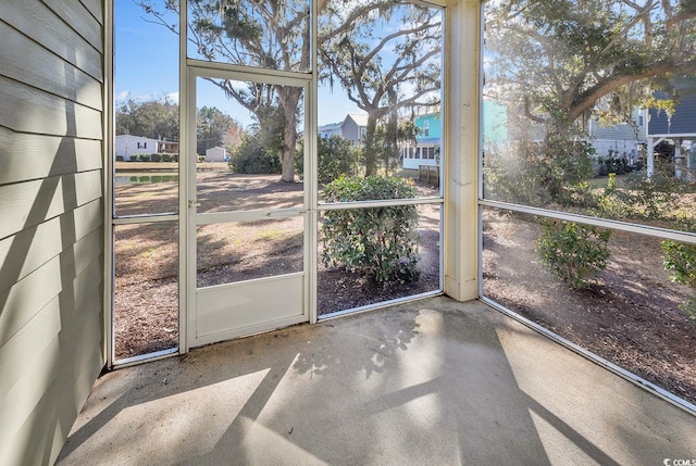 unfurnished sunroom with plenty of natural light