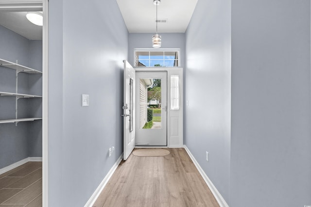 doorway to outside with hardwood / wood-style floors