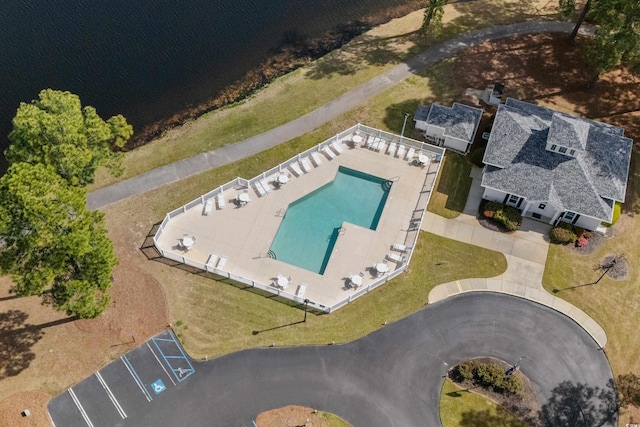 birds eye view of property with a water view