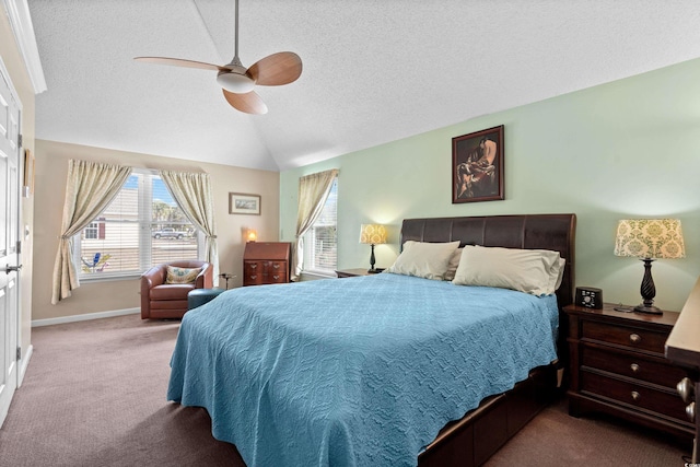 carpeted bedroom with ceiling fan, lofted ceiling, and a textured ceiling