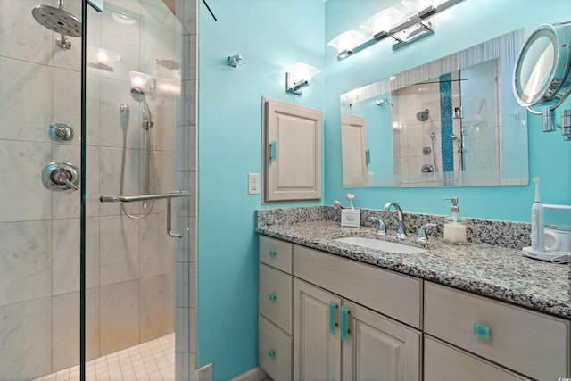 bathroom featuring vanity and an enclosed shower